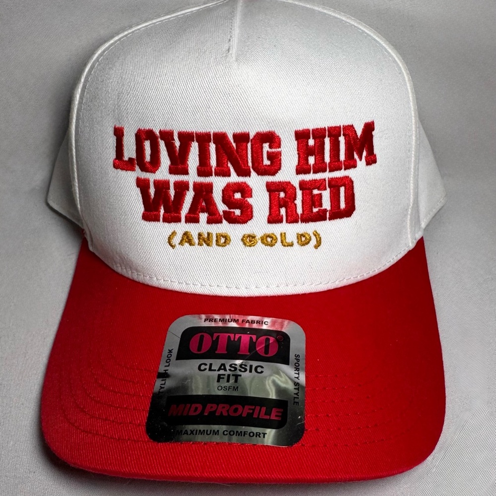 Loving him was red and gold trucker hat